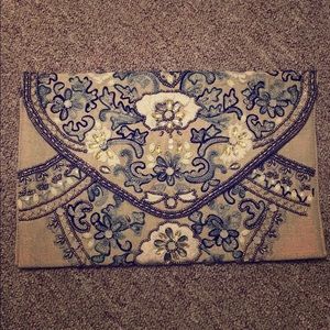 Nude bejeweled clutch